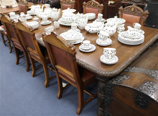 A late Victorian carved oak extending dining table, extends to 239cm W.121cm